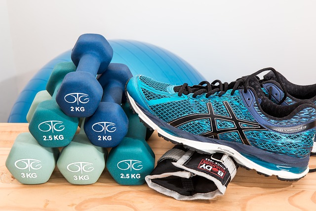 Exercise on Parkinson's motor functions - phot of dumbells and sneakers